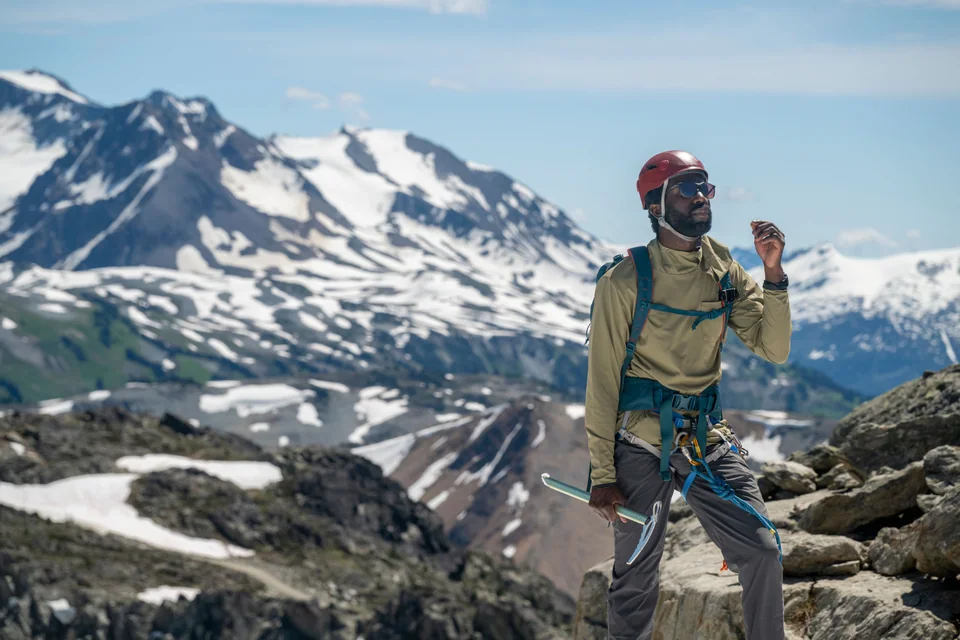 Portrait of climbing guide on mountain top